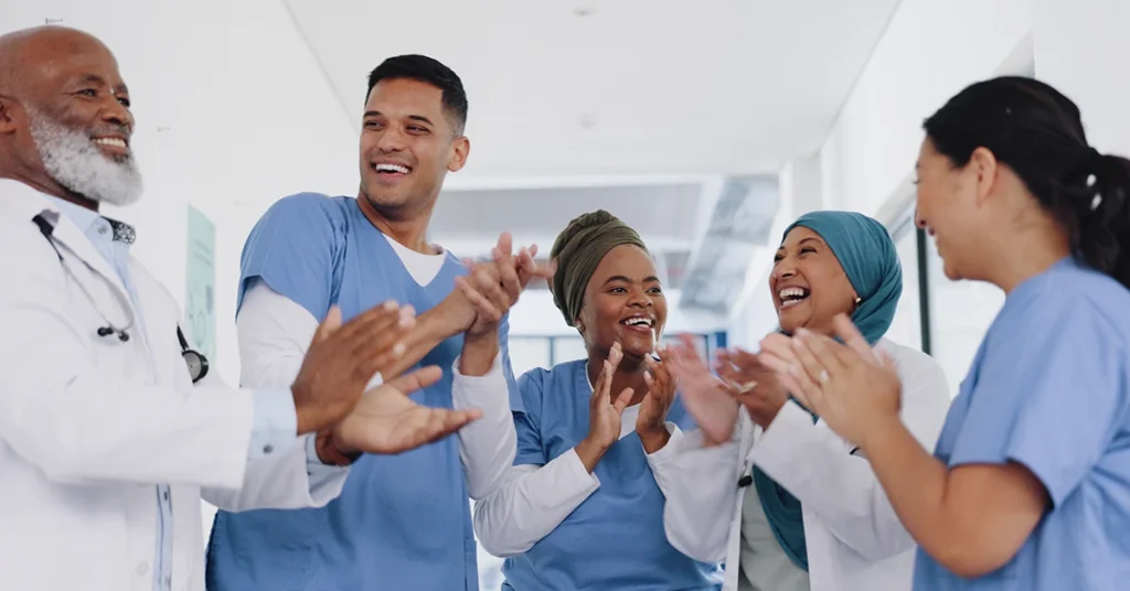 Group of happy nurses celebrating