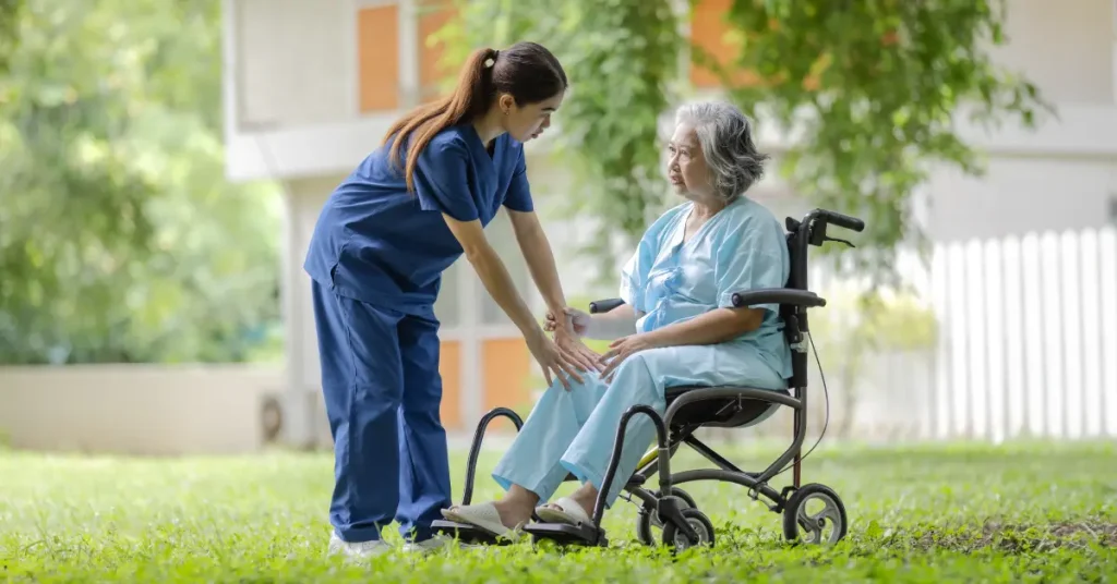 A nurse assists an elderly woman