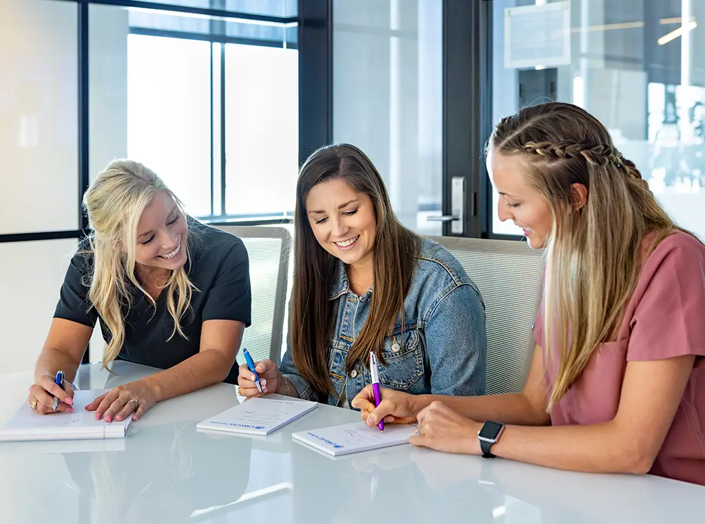 Nursing students collaborating with educator