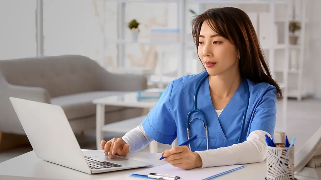 Aspiring family nurse practitioner reading the UWorld FNP study guide