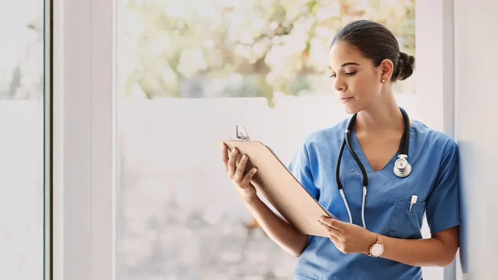 Nursing professional reviewing FNP info